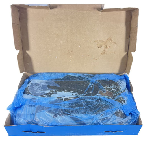 Open cardboard box with a blue plastic bag inside containing sole