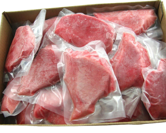 tuna portions vacuum sealed in open cardboard carton
