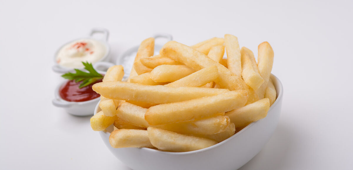 bowl of 10mm chips with condiments in background