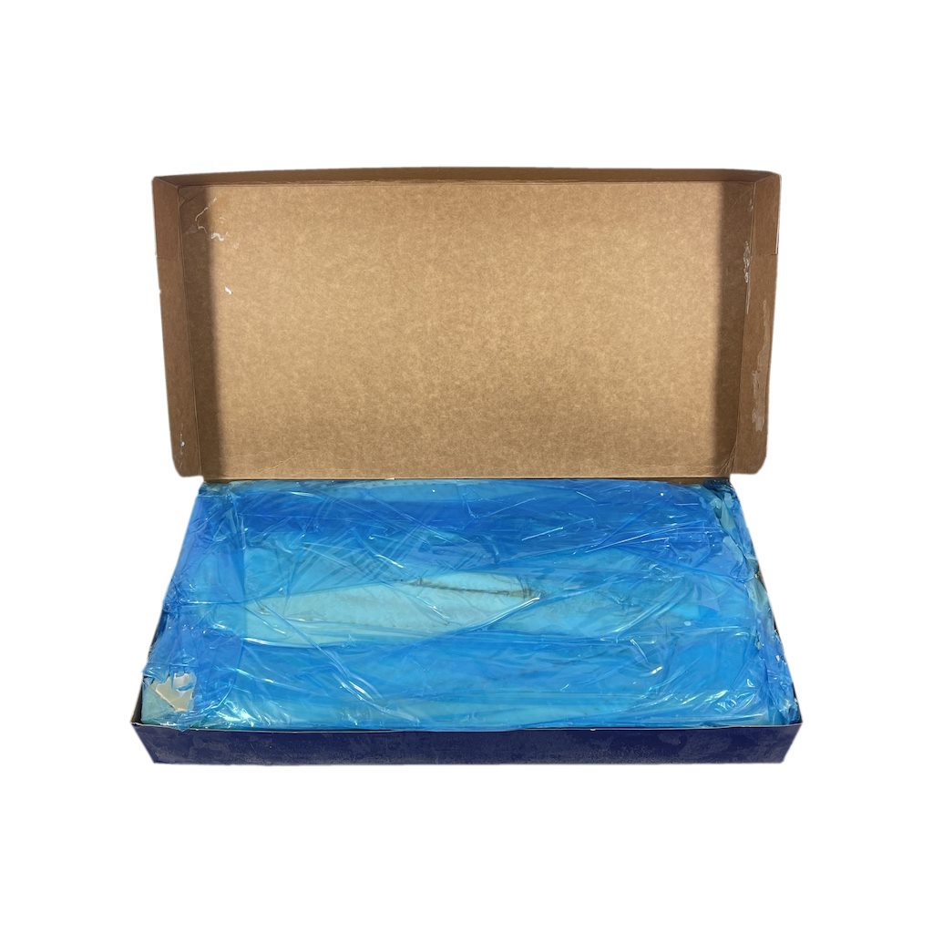 Open cardboard box with blue plastic wrapped deep sea cod fillets inside on a white background