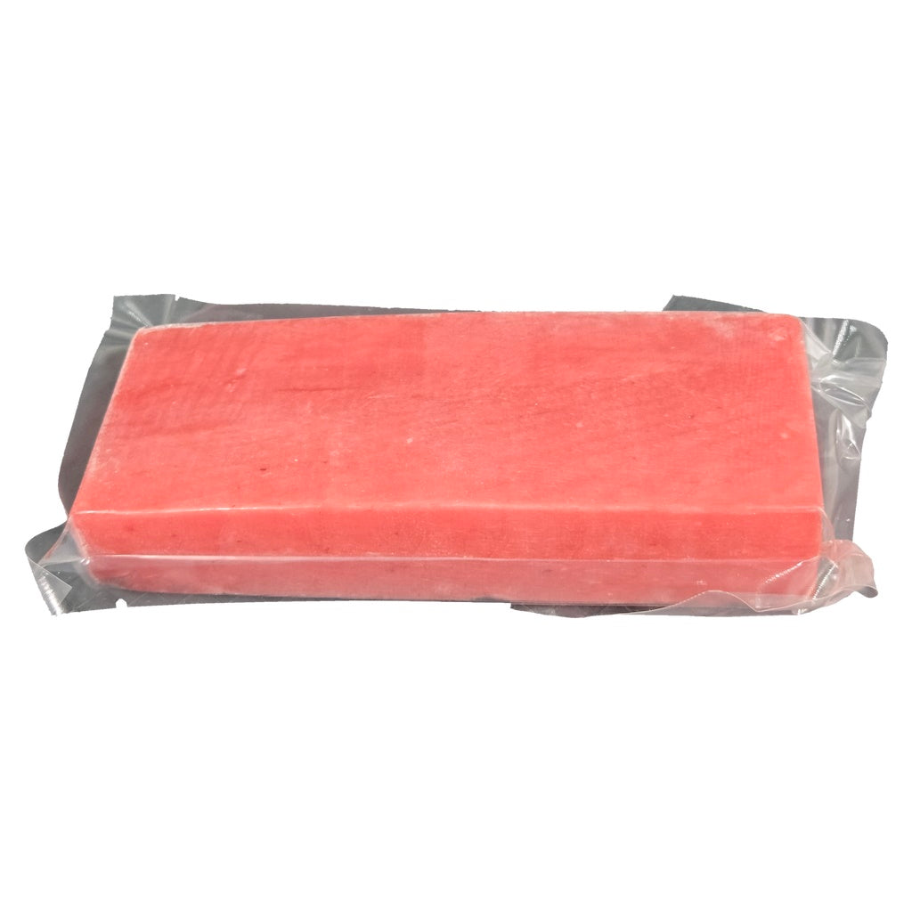 Rectangular tuna saku clear plastic packaging on a white background