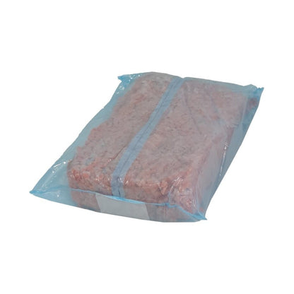bag of diced carrots in blue clear plastic bag on white background