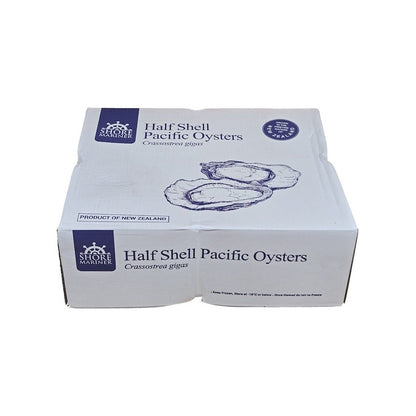 Box of half shell Pacific oysters with Shore Oyster branding on a white background
