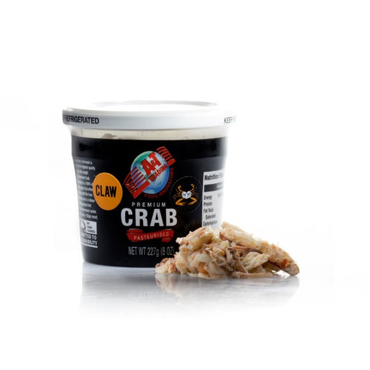 a tub of crab claw meat with meat outside with white background