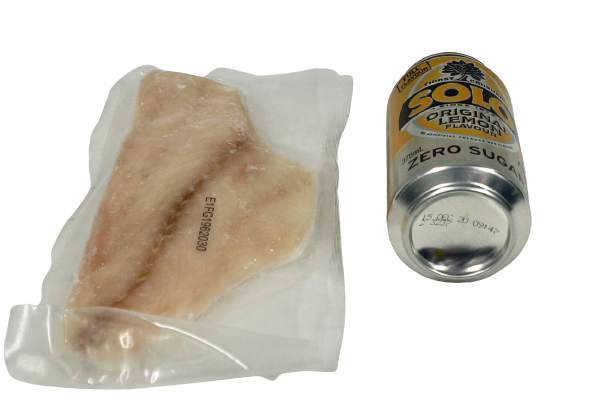 individual emperor fillet in vacuum pack next to can of drink no background