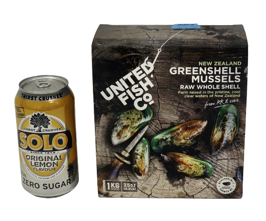 can of drink next to box of greenshell mussels
