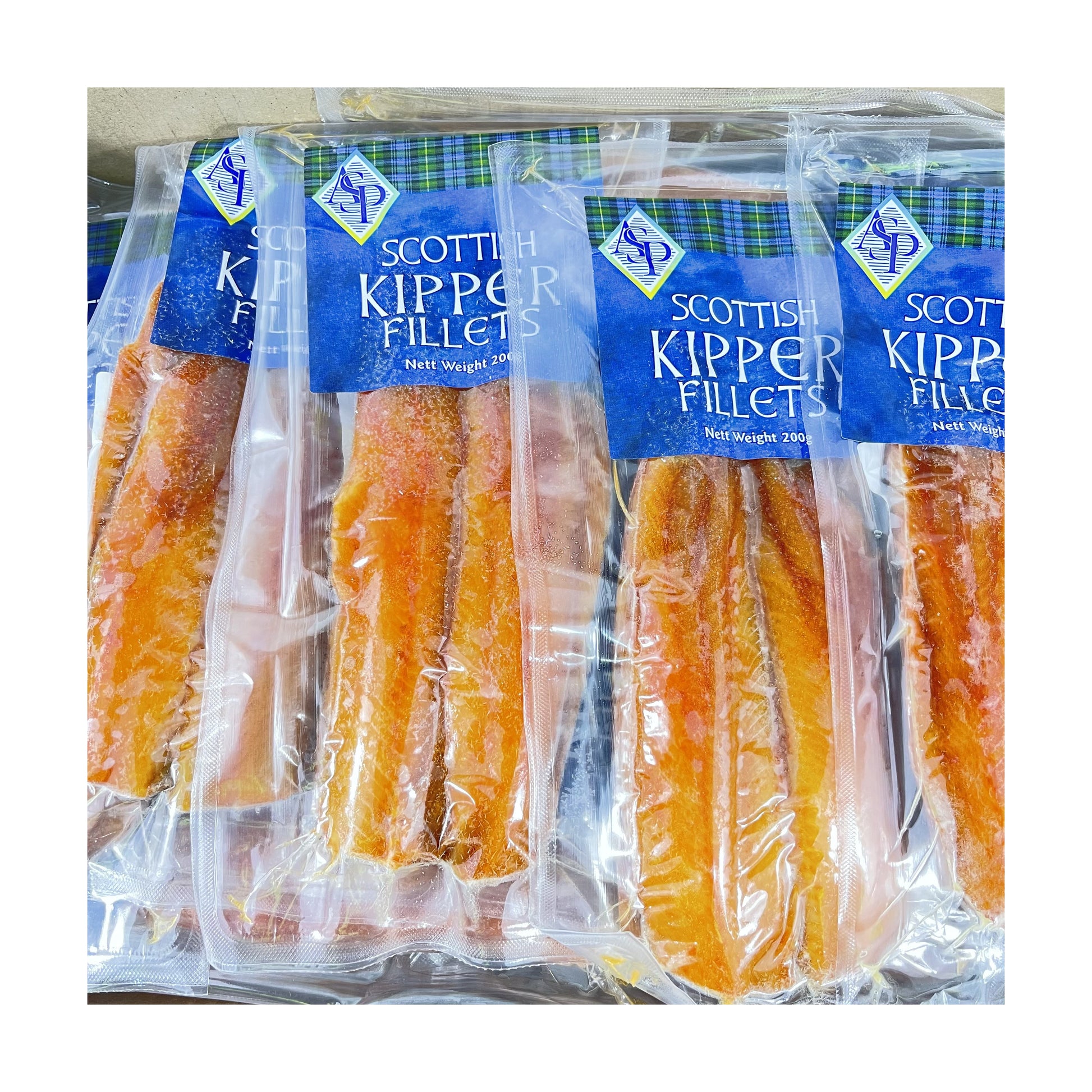 Vacuum-sealed packaging of Scottish Kipper Fillets, containing herring fillets in a visible orange-brown color.