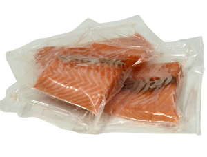 salmon portions in vacuum pack with no backgound