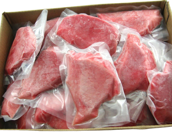 tuna portions vacuum sealed in open cardboard carton