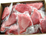 tuna portions vacuum sealed in open cardboard carton
