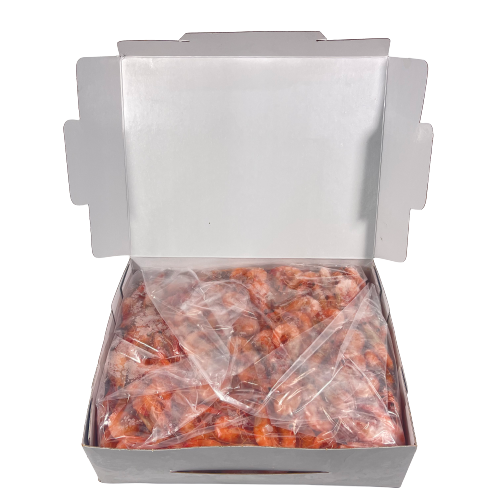 whole cooked king prawn inside open carton no background